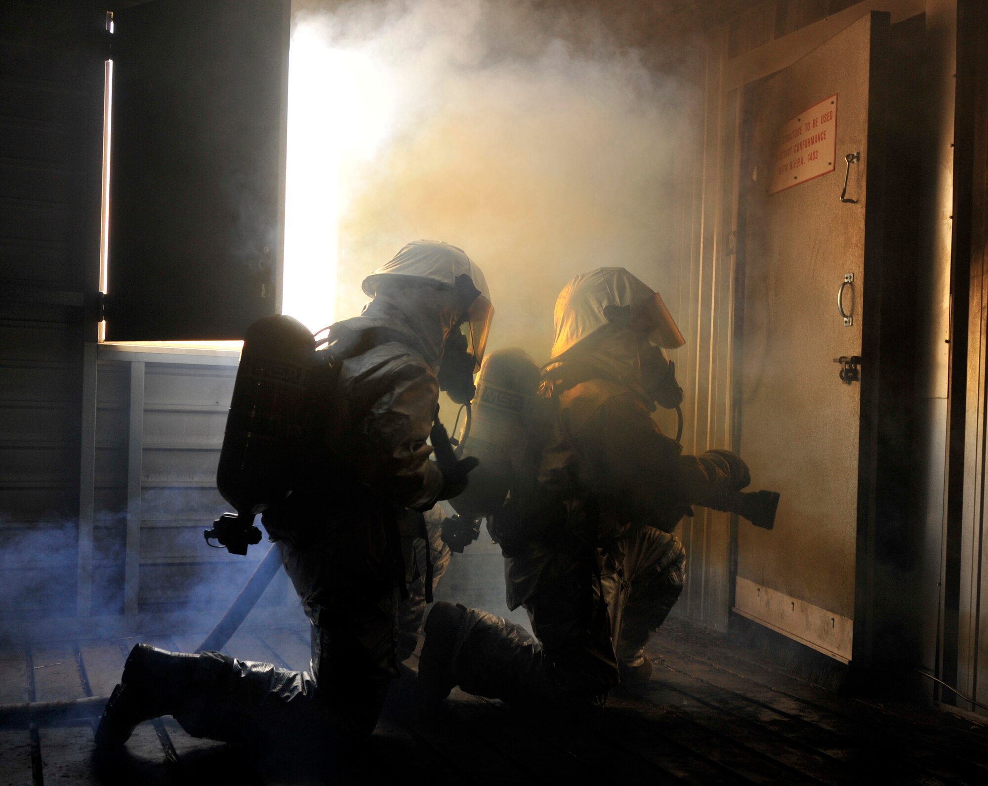 Senior Airman Curtis Sinkfield and Airman Darby Parker, both 19th Civil Engineer Squadron firefighters, perform proper procedures to put out a fire Oct. 28, during a building clearing and structural fire training scenario. The base’s firefighters often perform joint training with the fire departments in Jacksonville and North Little Rock, Ark., to enhance their mission-ready capabilities. (U.S. Air Force photo by Senior Airman Caleb Pierce)