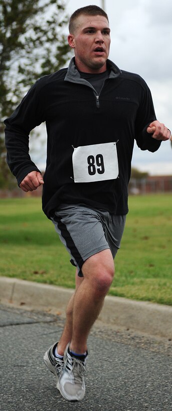 U.S. Air Force Airman 1st Class Aaron Plichta, 633rd Communications Squadron client systems technician, runs during the 2011 Langley First Sergeants’ Council 5K Run/Walk to benefit Operation Warmheart, at Langley Air Force Base, Va., Oct. 13, 2011. Operation Warmheart provides assistance to Langley Airman and their families year round. (U.S. Air Force photo by Airman 1st Class Teresa Cleveland/Released)