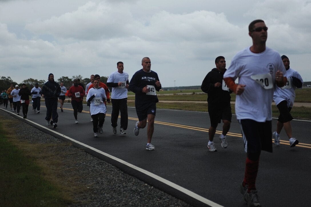 Men and women of Joint Base Langley-Eustis participate in the 2011 Langley First Sergeants’ Council 5K Food Run/Walk at Langley Air Force Base, Va., Oct. 13, 2011. The run/walk is an annual event in support of Operation Warmheart, the single largest community and outreach program for Langley AFB. (U.S. Air Force photo by Airman 1st Class Teresa Cleveland/Released)