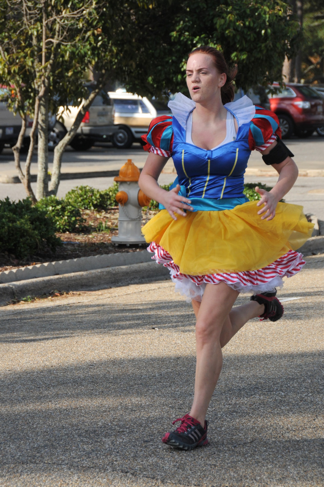 Airman 1st Class Emily Franklin, 345th Airlift Squadron, finishes the Halloween 5-kilometer run Oct. 28, 2011, at Keesler Air Force Base, Miss., with a time of 34 minutes, 30 seconds.  Franklin won second place in the costume contest, dressed as Snow White.  (U.S. Air Force photo by Kemberly Groue)