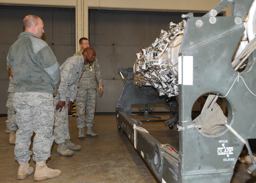 Master Sgt. Nathan Best, 7th Munitions Squadron, right, explains to a tour group how the rotary launcher works and what it takes to be repaired Oct. 28, 2011, at Dyess Air Force Base, Texas. The tour consisted of an inside look of Dyess’ bomb shelters, the recycling of old bomb facilities and the repair of rotary launchers located inside of the B-1 Bomber. (U.S. Air Force photo by Airman 1st Class Jonathan Stefanko/ Released)