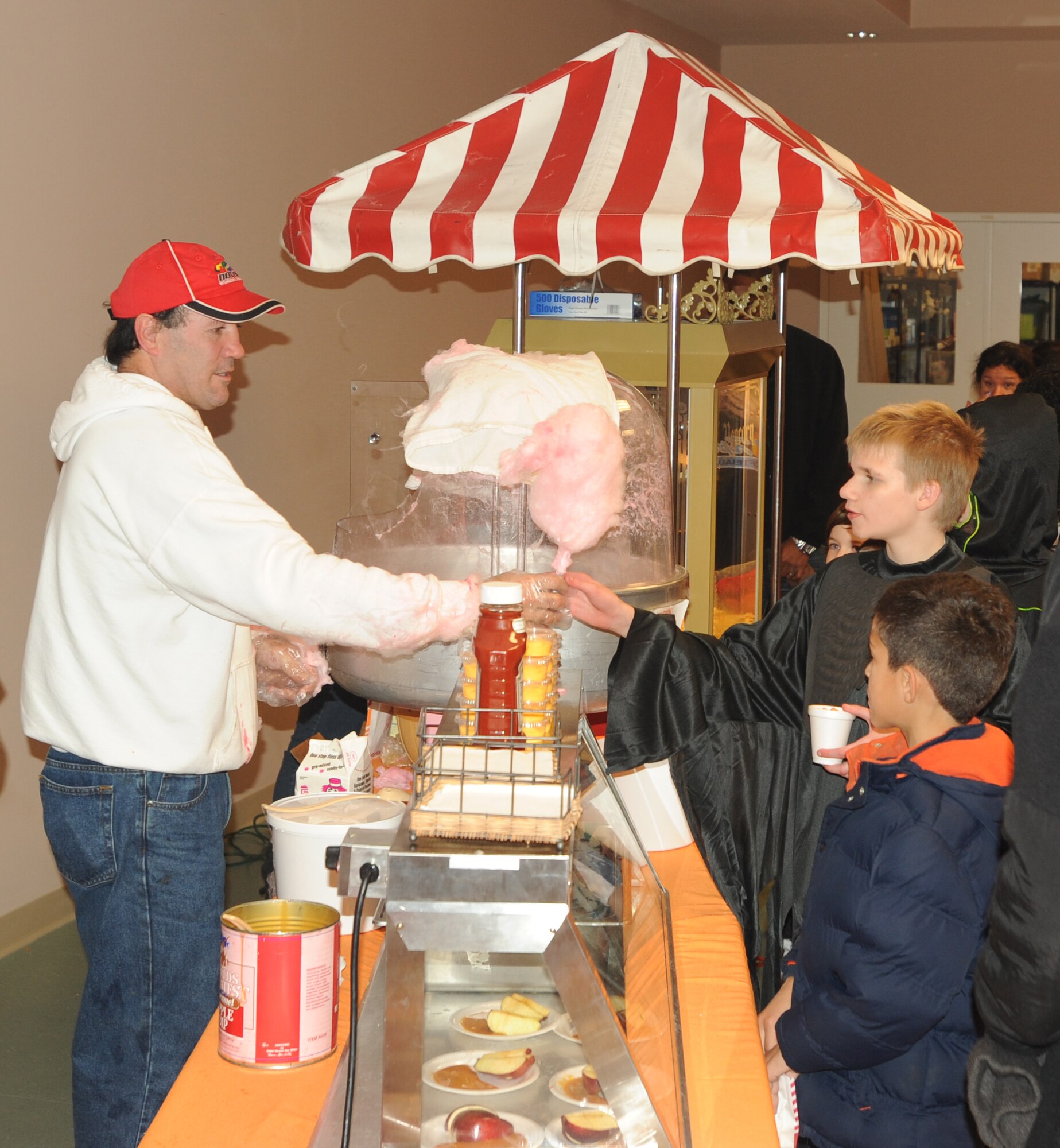 Hundreds of visitors braved the near freezing cold and rain Oct. 29 to attend the Youth Center Harvest Festival at Dover Air Force Base, Del.  The Harvest Festival had free food, games, face painting, prizes, candy and a pumpkin-painting table for kids.  The 436th Security Forces Squadron provided treat bags and glow sticks for trick or treaters.  (U.S. Air Force photo by Staff Sgt. Chad Padgett)