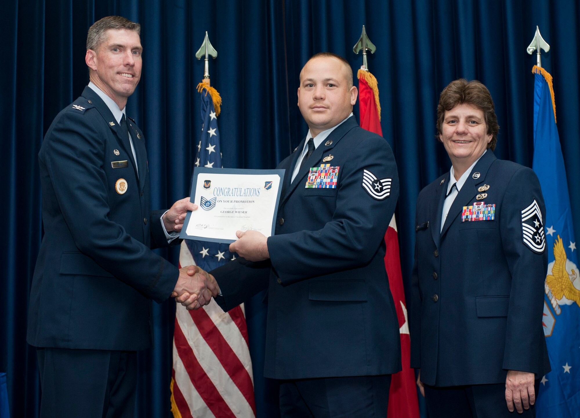 George Wieser, 39th Communications Squadron, is promoted to the rank of technical sergeant Oct. 31, 2011, in the Club Complex ballroom at Incirlik Air Base, Turkey.(U.S. Air Force photo by Senior Airman Clayton Lenhardt/Released)