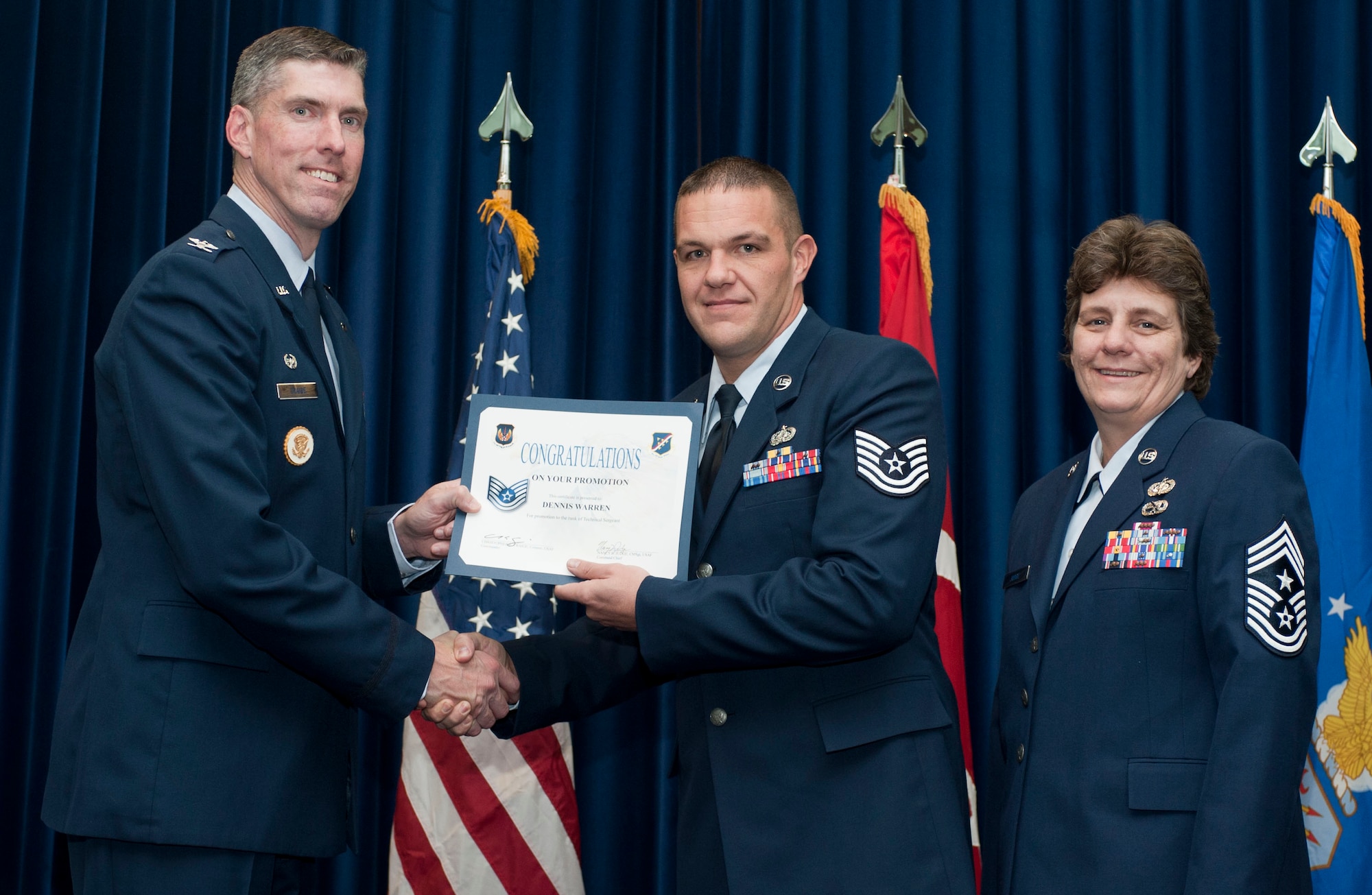 Dennis Warren, 39th Communications Squadron, is promoted to the rank of technical sergeant Oct. 31, 2011, in the Club Complex ballroom at Incirlik Air Base, Turkey.(U.S. Air Force photo by Senior Airman Clayton Lenhardt/Released)