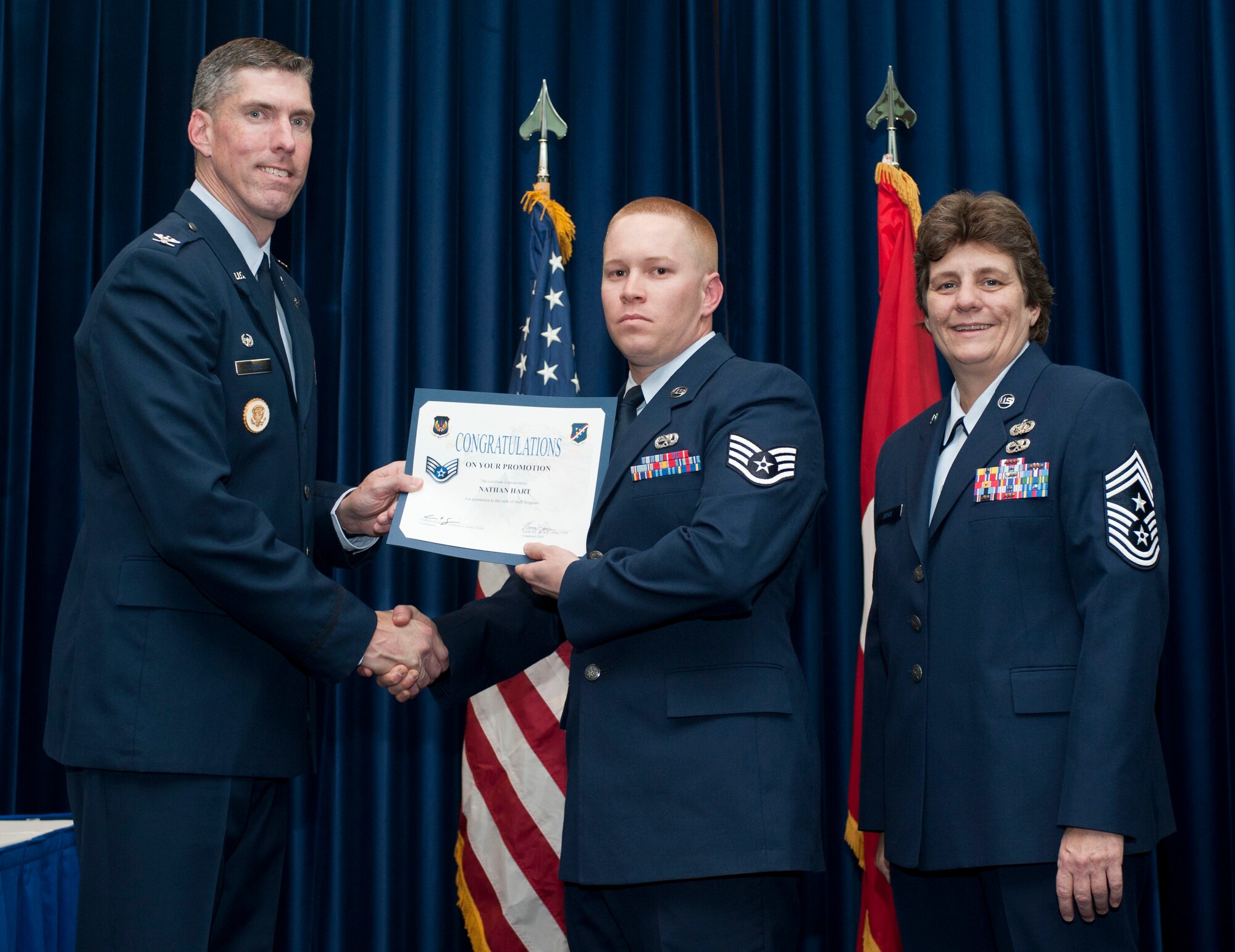 Nathan Hart, 728th Air Mobility Squadron, is promoted to the rank of staff sergeant Oct. 31, 2011, in the Club Complex ballroom at Incirlik Air Base, Turkey.(U.S. Air Force photo by Senior Airman Clayton Lenhardt/Released)