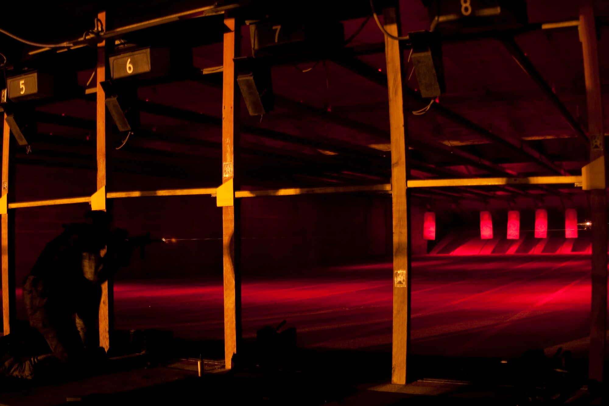 GRISSOM AIR RESERVE BASE, Ind.-- A Grissom 434th Security Forces Squadron Airmen fires down range in the kneeling supported position during a night time fire training exercise during a unit training exercise here recently.(U.S. Air Force photo/Senior Airman Damon Kasberg)