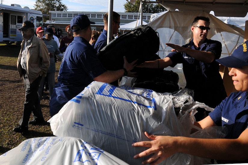 United States Coast Guard Maritime Law Enforcement Academy Charleston distributes sleeping bags and blankets to the homeless during the Stand Down Against Homelessness at the Armory Park Community Center Oct. 27.  The Ralph H. Johnson Veteran Affairs Medical Center and Goodwill Industries of the Lowcountry sponsored the 12th annual Stand Down Against Homelessness.  The event provided medical and dental assistance, clothing, food, haircuts and job and legal counseling for hundreds of homeless in the greater Charleston area.  (U.S. Navy photo/Petty Officer 3rd Class Brannon Deugan)
