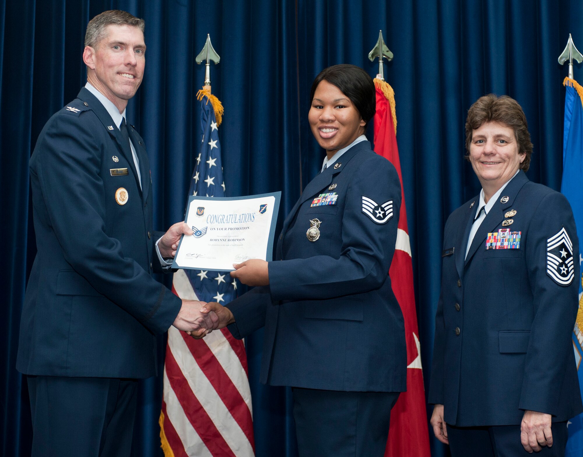 Robynne Robinson, 39th Security Forces Squadron, is promoted to the rank of staff sergeant Oct. 31, 2011, in the Club Complex ballroom at Incirlik Air Base, Turkey.(U.S. Air Force photo by Senior Airman Clayton Lenhardt/Released)