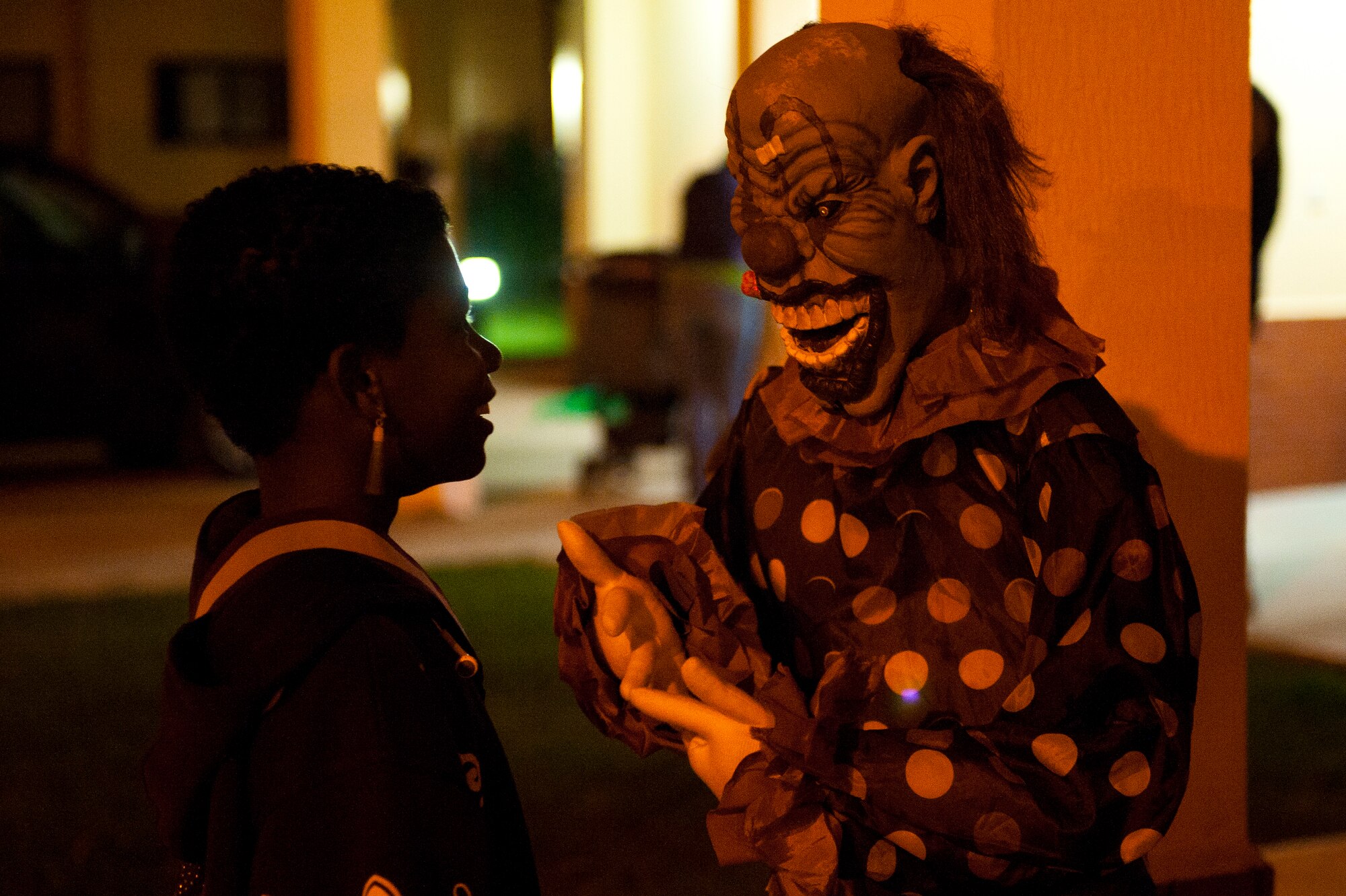 A child laughs at a Halloween decoration display Oct. 31, 2011, at Incirlik Air Base, Turkey. Base housing was open from 6-8 p.m. for all ages to celebrate Halloween together, dress in costumes and collect treats. (U.S. Air Force photo by Tech. Sgt. Michael B. Keller/Released)