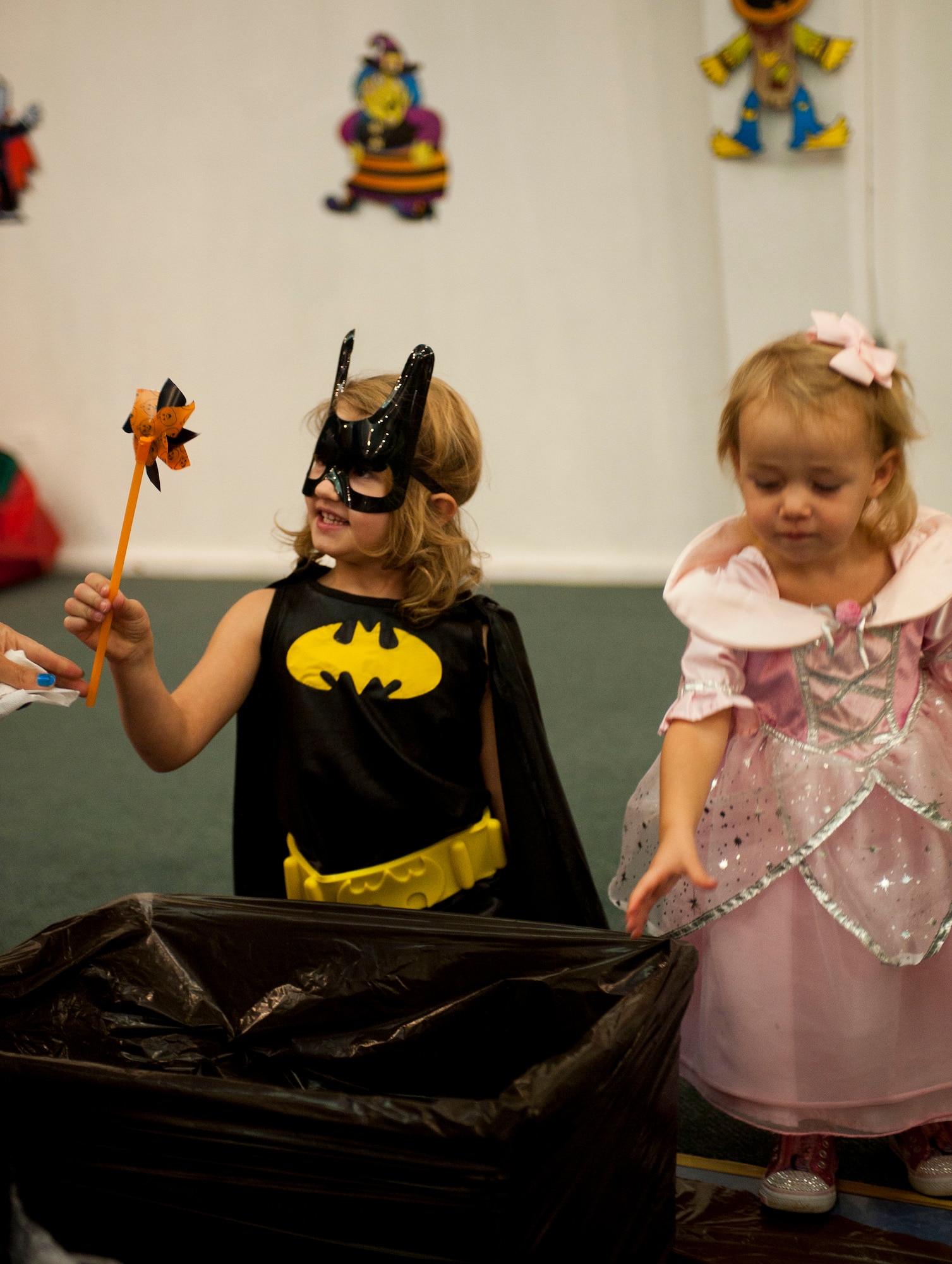 A child receives a pinwheel during the Children's Halloween Party Oct. 31, 2011, at the Community Center, Incirlik Air Base, Turkey. The party included games, treats and Halloween crafts. (U.S. Air Force photo by Senior Airman Clayton Lenhardt/Released)