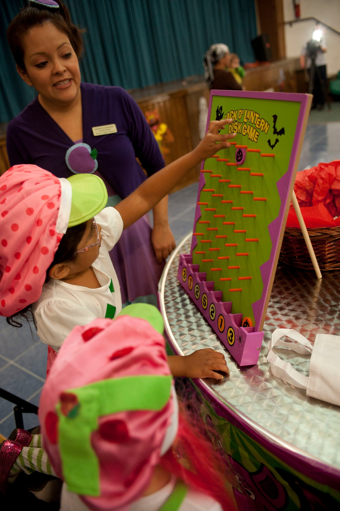 A child plays a game during the Children's Halloween party Oct. 31, 2011, at the Community Center, Incirlik Air Base, Turkey. The party included games, treats and Halloween crafts. (U.S. Air Force photo by Senior Airman Clayton Lenhardt/Released)