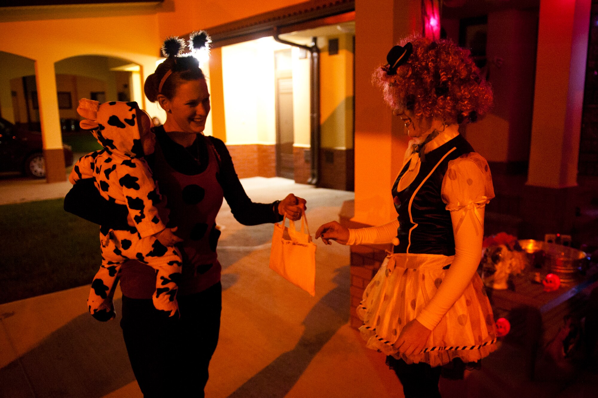 Team Incirlik members participate in trick or treating Oct. 31, 2011, at Incirlik Air Base, Turkey. Base housing was open from 6-8 p.m. for all ages to celebrate Halloween together, dress in costumes and collect treats. (U.S. Air Force photo by Tech. Sgt. Michael B. Keller/Released)