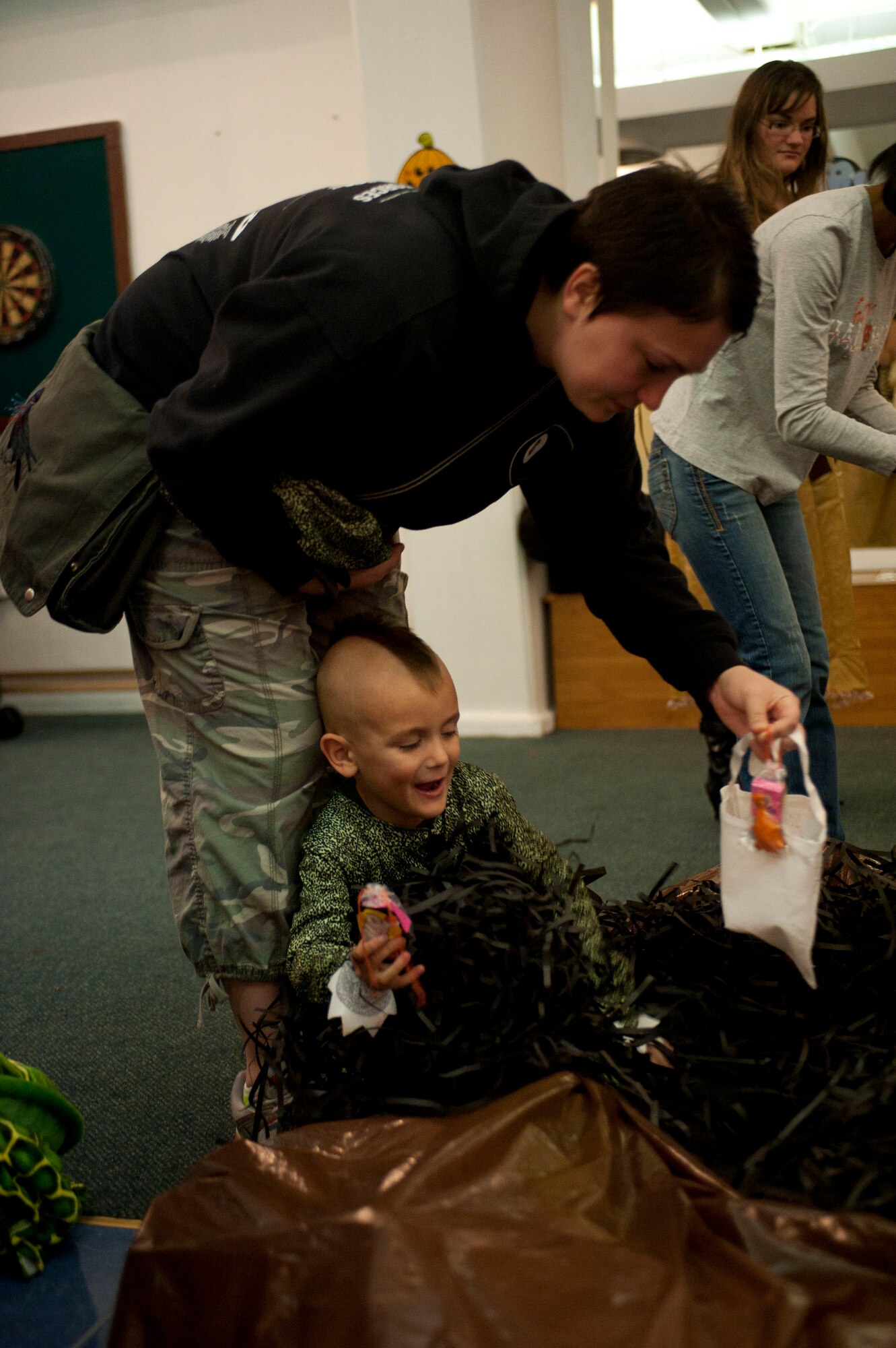 A mother and her son take part in the Children's Halloween Party Oct. 31, 2011, at the Community Center, Incirlik Air Base, Turkey. The party included games, treats and Halloween crafts. (U.S. Air Force photo by Senior Airman Clayton Lenhardt/Released)