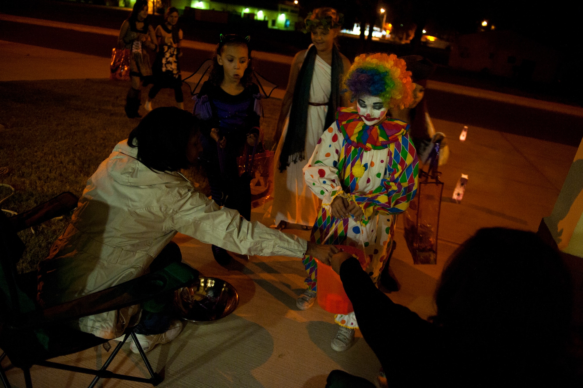 Team Incirlik members participate in trick or treating Oct. 31, 2011, at Incirlik Air Base, Turkey. Base housing was open from 6-8 p.m. for all ages to celebrate Halloween together, dress in costumes and collect treats. (U.S. Air Force photo by Tech. Sgt. Michael B. Keller/Released)