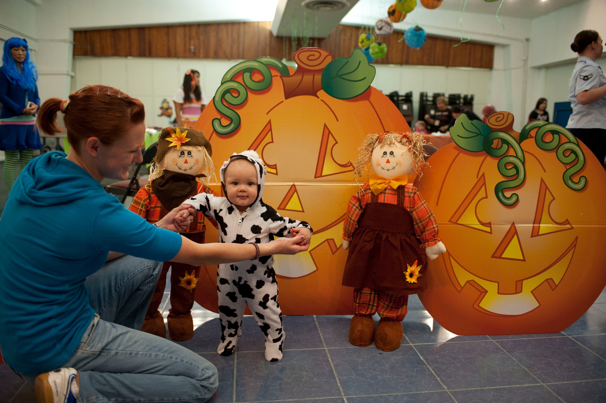 A mother and her daughter take part in the Children's Halloween Party Oct. 31, 2011, at the Community Center, Incirlik Air Base, Turkey. The party included games, treats and Halloween crafts. (U.S. Air Force photo by Senior Airman Clayton Lenhardt/Released)
