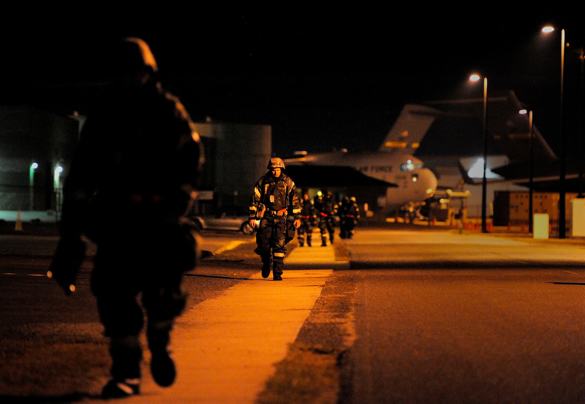 Members of the 628th Air Base Wing make their way to their areas of responsibility during an Operational Readiness Exercise at the Combat Readiness Training Center in Gulfport, Miss., Oct. 28. The ORE is intended to evaluate Team Charleston's ability to "take the fight to the enemy" and objectively measure mission effectiveness. (U.S. Air Force photo/Staff Sgt. Henry Lancaster)


