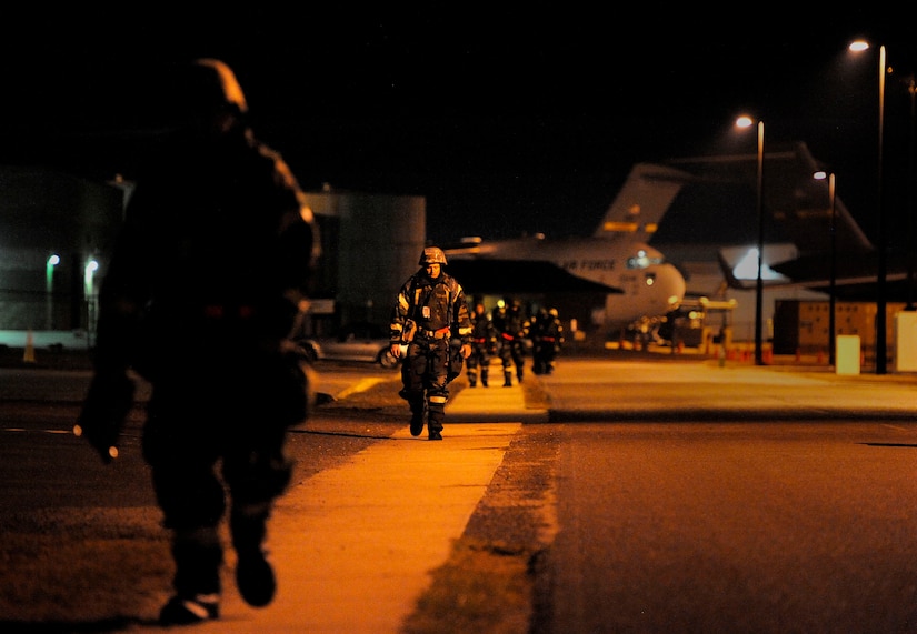 Members of the 628th Air Base Wing make their way to their areas of responsibility during an Operational Readiness Exercise at the Combat Readiness Training Center in Gulfport, Miss., Oct. 28. The ORE is intended to evaluate Team Charleston's ability to "take the fight to the enemy" and objectively measure mission effectiveness. (U.S. Air Force photo/Staff Sgt. Henry Lancaster)