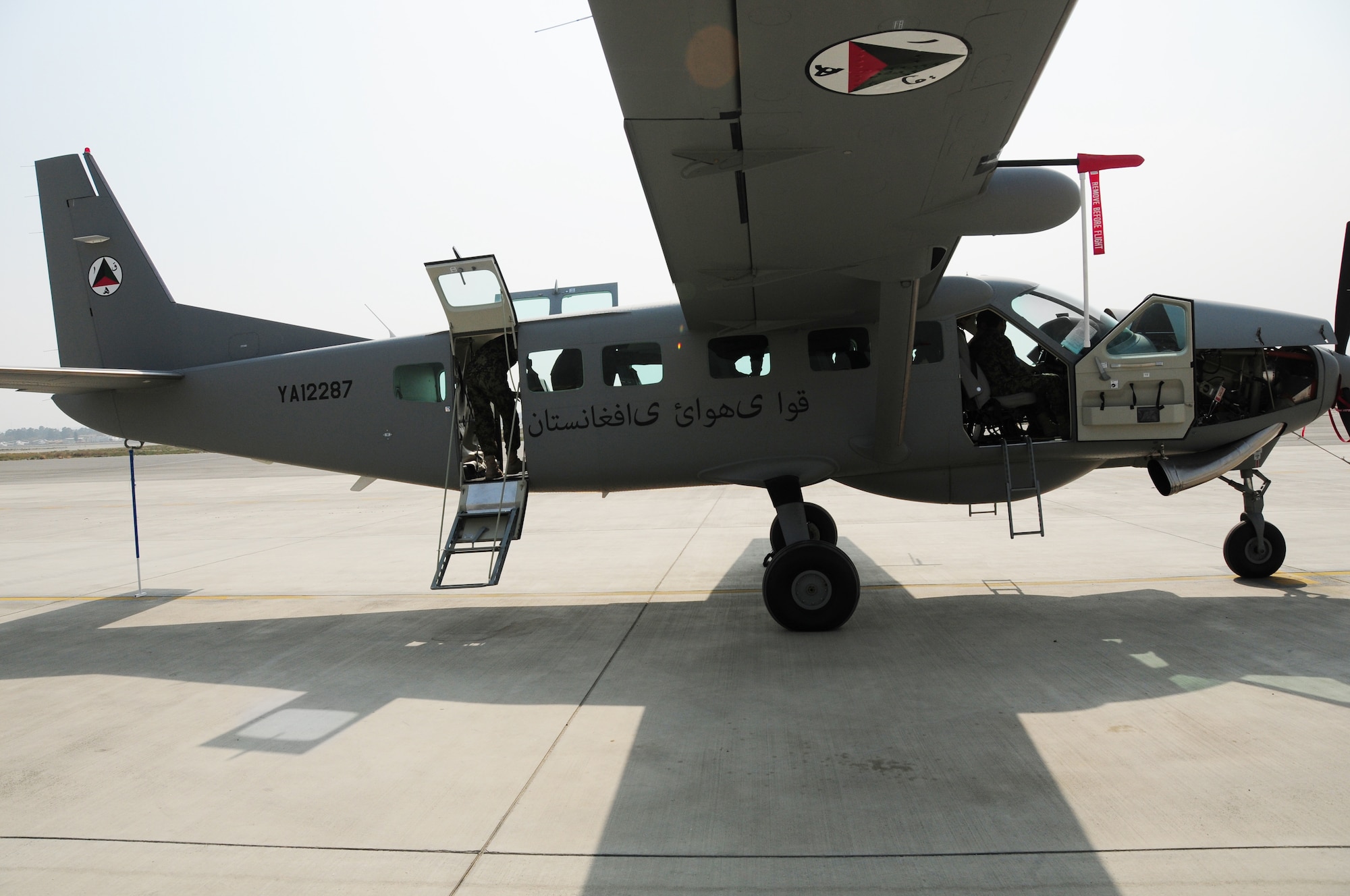 A new Afghan Air Force C-208B sits on the flight line at Kabul International Airport, Kabul, Afghanistan November 1, 2011.  The Cessna was on a “road show” tour around Afghanistan.  (U.S. Air Force photo by Senior Airman Amber Williams)