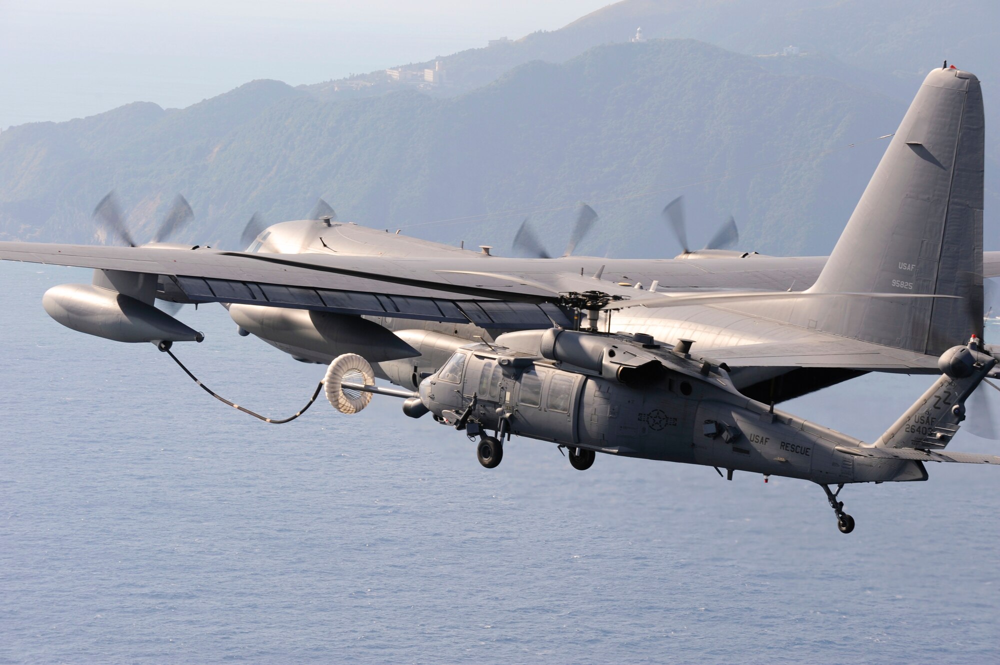 An MC-130P Combat Shadow from the 17th Special Operations Squadron refuels HH-60G Pave Hawks from the 33rd Rescue Squadron, both stationed at Kadena Air Base, Okinawa, as they fly to Osan Air Base Korea for PACIFIC THUNDER Oct. 27.

PACIFIC THUNDER is an annual 10-day exercise that takes place Oct. 31- Nov. 9 at Osan Air Base, Korea involving the 33rd Rescue Squadron, Kadena Air Base, Japan, and the 25th Fighter Squadron, Osan Air Base, Korea. These units work together to practice Combat Search and Rescue tactics to prepare for real-world emergency situations. 
(U.S. Air Force photo/Tech. Sgt. Angelique Bilog)