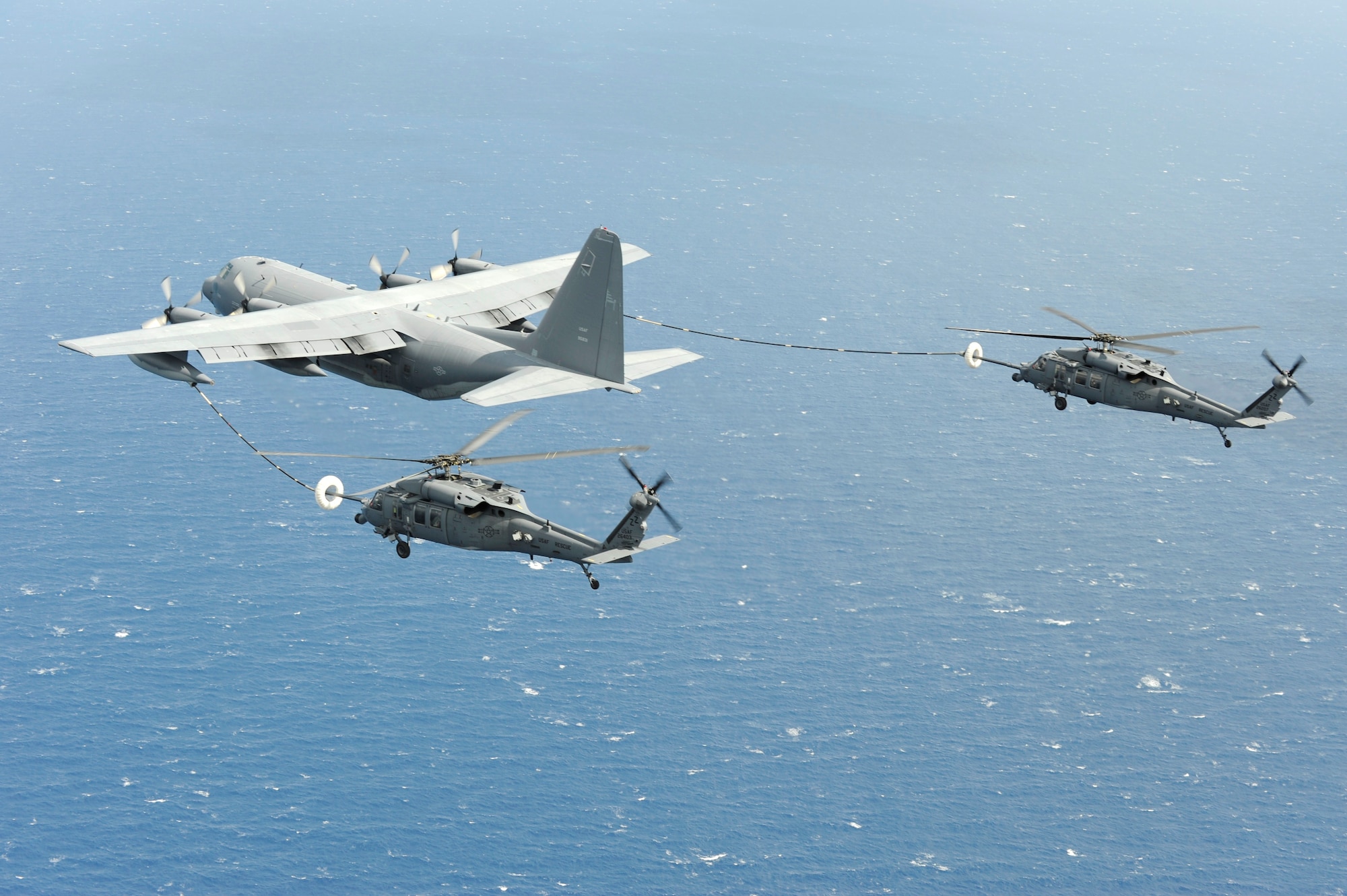 An MC-130P Combat Shadow from the 17th Special Operations Squadron refuels HH-60G Pave Hawks from the 33rd Rescue Squadron, both stationed at Kadena Air Base, Okinawa, as they fly to Osan Air Base Korea for PACIFIC THUNDER Oct. 27.

PACIFIC THUNDER is an annual 10-day exercise that takes place Oct. 31- Nov. 9 at Osan Air Base, Korea involving the 33rd Rescue Squadron, Kadena Air Base, Japan, and the 25th Fighter Squadron, Osan Air Base, Korea. These units work together to practice Combat Search and Rescue tactics to prepare for real-world emergency situations. 
(U.S. Air Force photo/Tech. Sgt. Angelique Bilog)