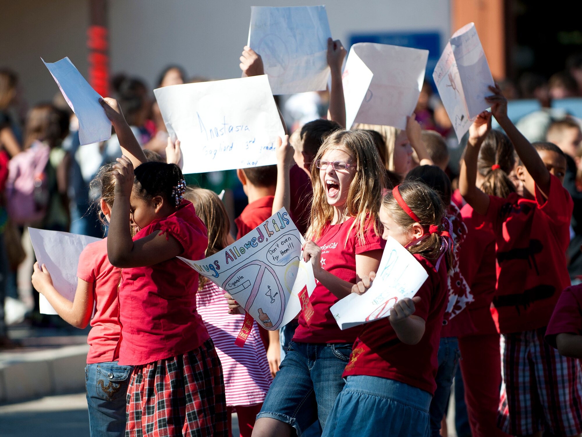 Children and school teachers carry posters and banners during a parade celebrating Red Ribbon Week, Oct. 28, 2011, at Incirlik Air Base, Turkey. Red Ribbon Week is a campaign that promotes drug prevention and education with the ultimate goal of a drug-free America. Red Ribbon Week was celebrated Oct. 23-31 this year. (U.S. Air Force photo by Senior Airman Clayton Lenhardt/Released)