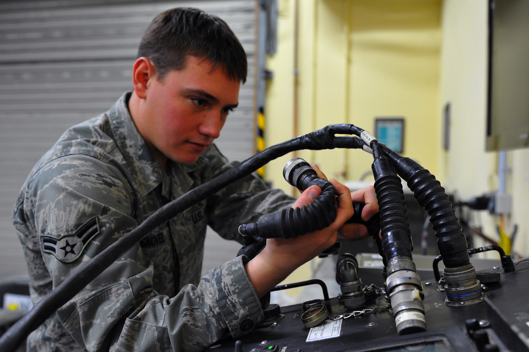 SPANGDAHLEM AIR BASE, Germany – Airman 1st Class Travis Snovel, 52nd Equipment Maintenance Squadron precision-guided munitions maintenance crew member, self tests a guided missile test set inside the missile maintenance shop here Oct. 27. The 52nd Equipment Maintenance Squadron tests every munition on base after 20 flights or after 180 days to guarantee mission surety and provide combat power to U.S. European Command. (U.S. Air Force photo/Airman 1st Class Dillon Davis)