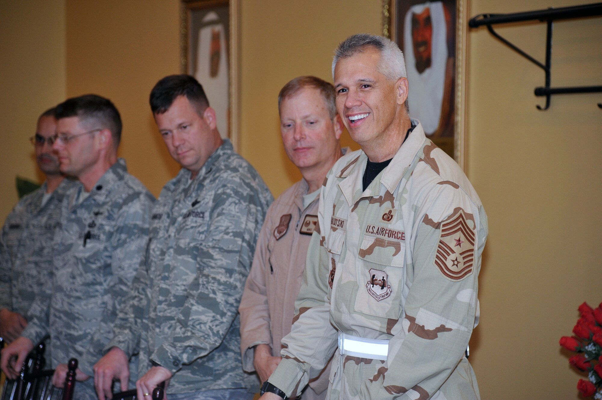 Chief Master Sgt. Mitchell Balutski, 386th Air Expeditionary Wing command chief, celebrates his final reenlistment Oct.30 at an undisclosed location is Southwest Asia. (U.S. Air Force photo by Master Sgt. Carlotta Holley)