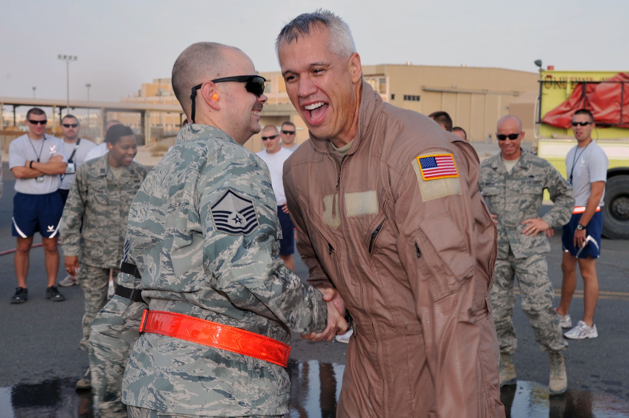Chief Master Sgt. Mitchell Balutski, 386th Air Expeditionary Wing command chief, celebrates his final reenlistment Oct.30 at an undisclosed location is Southwest Asia. (U.S. Air Force photo by Master Sgt. Carlotta Holley)