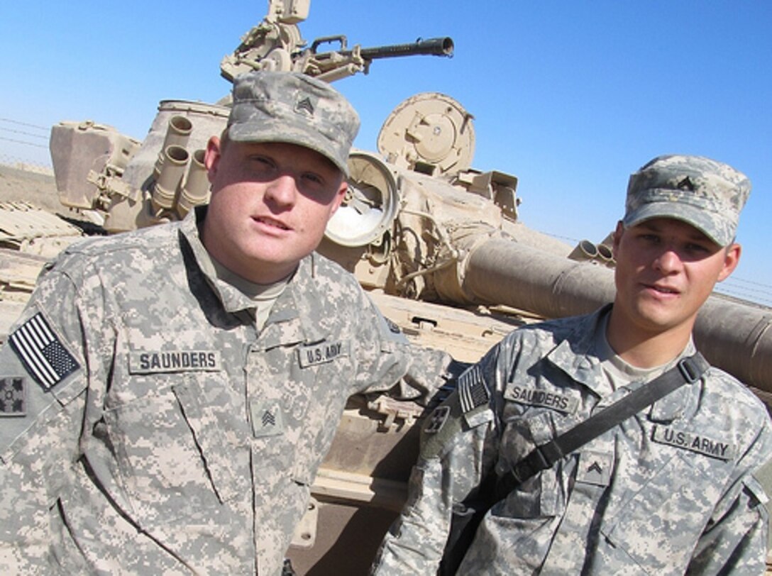 Army Sgt. Jonas Saunders, left, stands beside his twin brother, Army