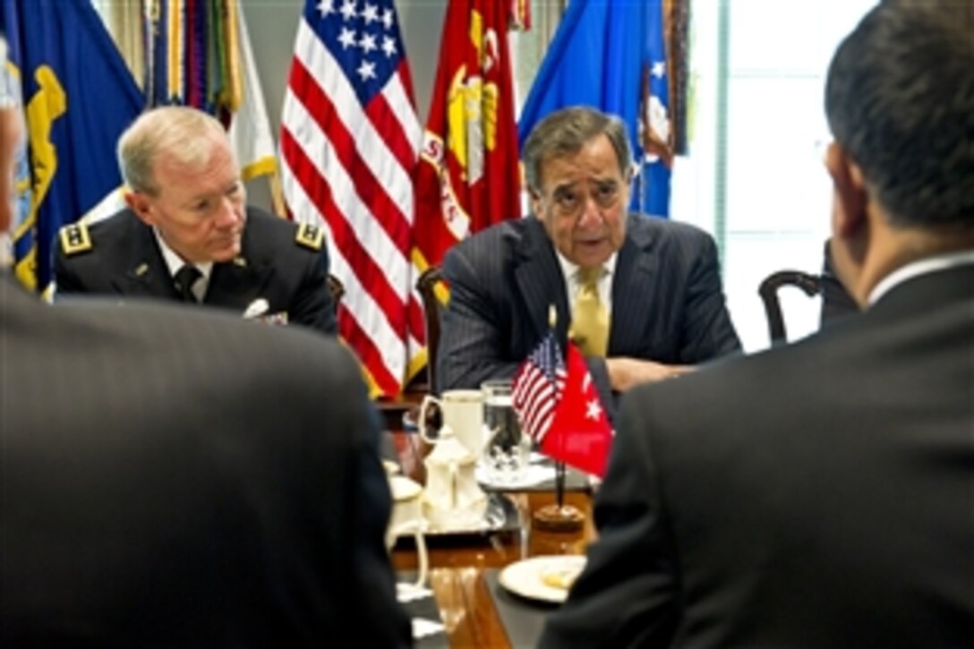 U.S. Defense Secretary Leon E. Panetta, right, and U.S. Army Gen. Martin E. Dempsey, chairman of the Joint Chiefs of Staff, meet with Turkish Defense Minister Ismet Yilmaz at the Pentagon, Nov. 1, 2011.
