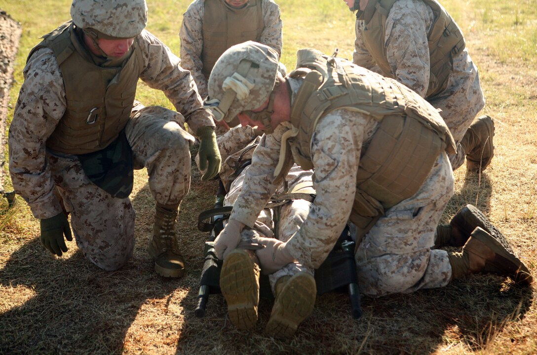 Sailors with 2nd Medical Battalion, Combat Logistics Regiment 25, 2nd Marine Logistics Group tend to a simulated casualty during a field exercise at Landing Zone Lark aboard Camp Lejeune, N.C., Nov. 2, 2011. The five-day exercise included patrols, simulated improvised explosive device training, ambushes by insurgents and treating wounded patients for an array of injuries. (U.S. Marine Corps photo by Pfc. Franklin E. Mercado)