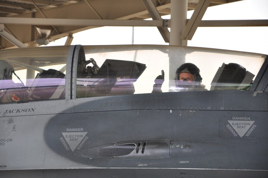 Andrea Mason, public affairs specialist for the 388th Fighter Wing, gives the thumbs up before her F-16 flight Oct. 25. (U.S. Air Force photo by Senior Airman Melissa Dearstone/Released).