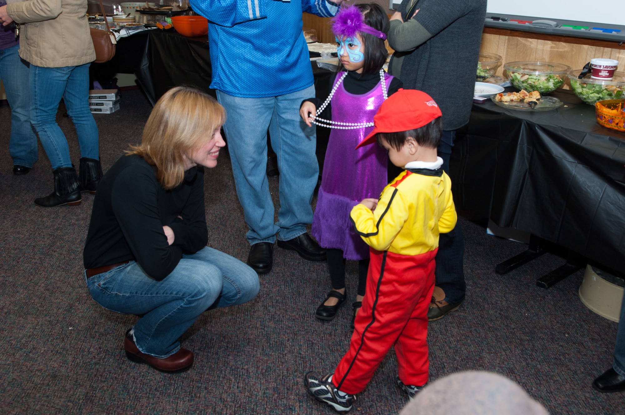 HANSCOM AIR FORCE BASE, Mass. – Key Spouse Shannon LaPuma (left) talks to Isabel and Lucas Balmecda during the Hearts Apart event for families of extended TDY, deployed and remote tour servicemembers at the Airman and Family Readiness Center Oct. 27. Key Spouses perform an essential role, acting as unit ambassadors and conduits of information to help ease the stress of temporary separations. (U.S. Air Force photo by Mark Herlihy)