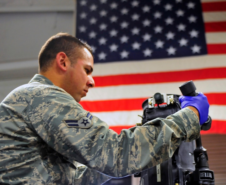 Airman 1st Class Samuel Ortiz, 20th Equipment Maintenance Squadron armament flight technician, works on the gun of an F-16 at Shaw Air Force Base, S.C. Nov. 2, 2011. Ortiz was the Warrior of the Week for the week of Oct.31 through November 4. (U.S. Air Force photo/ Airman 1st Class Daniel Phelps/ Released)