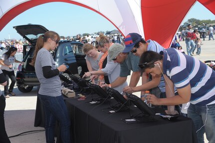 A record crowd of 150,000 attended the 2011 Randolph Air Force Base Airshow Oct. 30. Headlining this year's event were the U.S. Navy Blue Angels. (U.S. Air Force photo/Joel Martinez)