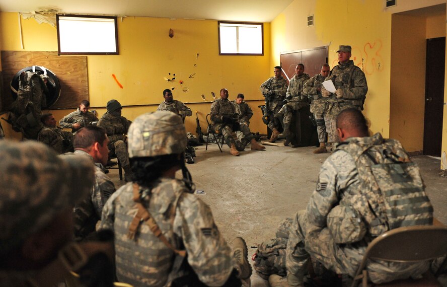 U.S. Air Force Tech. Sgt. Lee Fulp, 820th Combat Operations Squadron NCO in charge of counter improvised explosive devices training, trains Airmen from the 823rd Base Defense Squadron and 105th Security Forces Squadron how to operate in an environment with improvised explosive devices and how to counter those measures during a joint training exercise at Camp Smith, N.Y., Oct. 27, 2011. EOD is one of the many Air Force specialty codes attached to the 823rd BDS that participated in training the Airmen. (U.S. Air Force photo by Staff Sgt. Stephanie Mancha/Released)