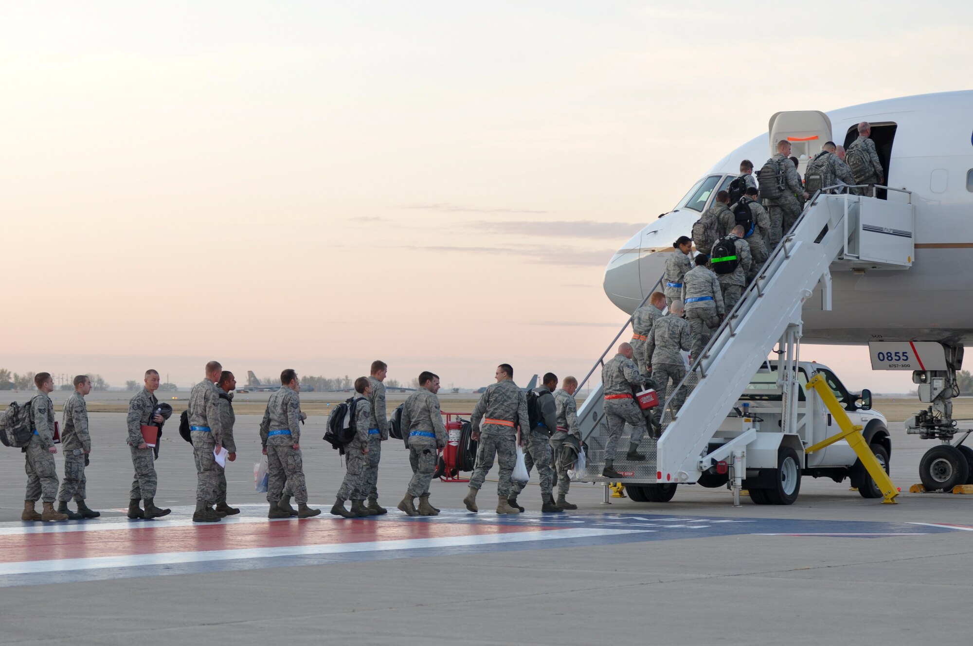 MINOT AIR FORCE BASE, N.D. – Team Minot Airmen board a plane here Oct. 22 in support of Global Thunder 2012. Exercise Global Thunder 12 is U.S. Strategic Command’s annual field training and battle staff exercise, designed to exercise all mission areas with primary emphasis on nuclear command and control. (U.S. Air Force photo/Airman 1st Class Jessica McConnell)