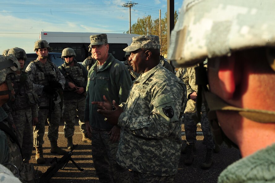 MINOT AIR FORCE BASE, N.D. -- Gen. C. Robert Kehler, U.S. Strategic Command commander visits Security Forces Airmen during U.S. STRATCOM’s annual field training and battle staff exercise here Oct. 20. Kehler made the trip to the base to observe Airmen participating in the exercise at the nation’s only dual-wing nuclear capable base. The exercise provides training opportunities for forces to deter, and if necessary defeat, a military attack against the United States. (U.S. Air Force Photo/Senior Airman Jesse Lopez)