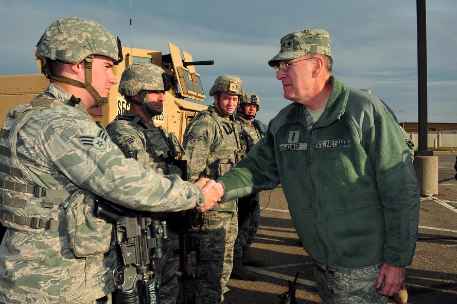MINOT AIR FORCE BASE, N.D. -- Gen. C. Robert Kehler, U.S. Strategic Command commander visits Security Forces Airmen during U.S. STRATCOM’s annual field training and battle staff exercise here Oct. 20. Kehler made the trip to the base to observe Airmen participating in the exercise at the nation’s only dual-wing nuclear capable base. The exercise provides training opportunities for forces to deter, and if necessary defeat, a military attack against the United States. (U.S. Air Force Photo/Senior Airman Jesse Lopez)