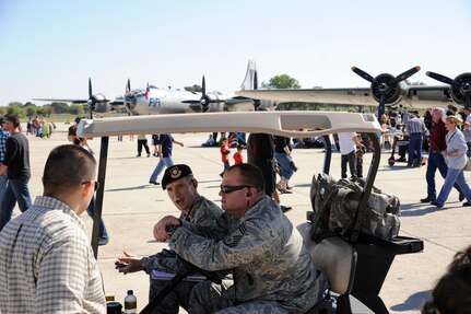 902nd Security Forces Squadron members assist spectators during the 2011 Randolph Air Force Base Airshow Oct. 29. Randolph's air show allowed attendees to get up close and personal to see some of the equipment and aircraft used by the U.S. military servicemembers and Department of Defense civilians today. (U.S. Air Force Photo by Don Lindsey)