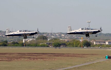 Pilots from Randolph Air Force Base fly Randolph's own T-6A Texan II in the 2011 Randolph Air Force Base Airshow Oct.29. Randolph is an instructor pilot base-training pilots to train others. (U. S. Air Force Photo by Don Lindsey)
