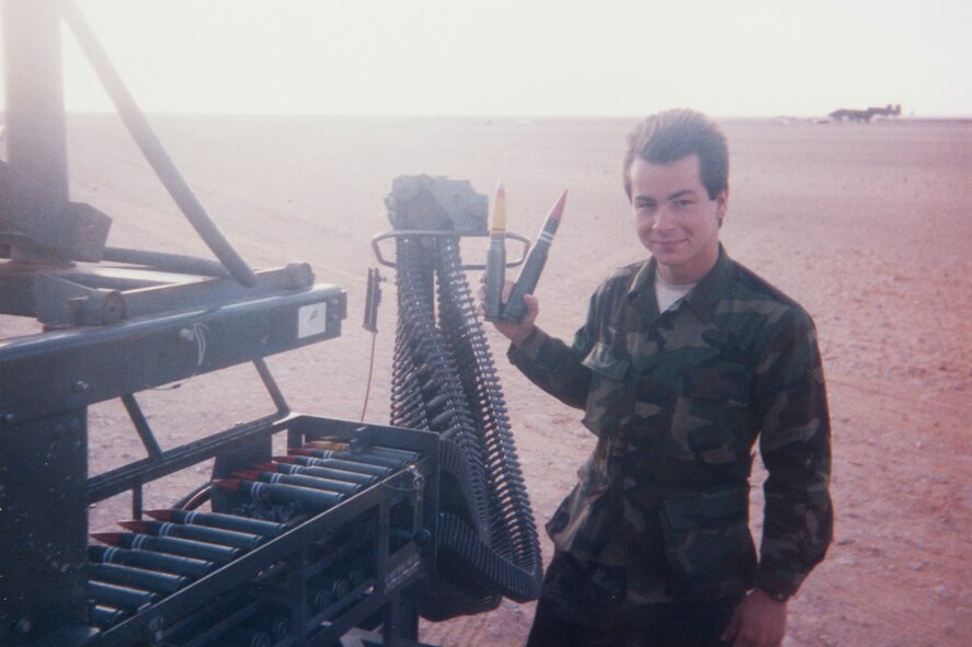 A young U.S. Air Force Master Sgt. William Godwin holds up party-mix rounds in early 1991 during a deployment to Saudi Arabia. During the deployment, Godwin served as a load crew member for A-10 Thunderbolts that destroyed scud missiles near the coast of Israel. (Courtesy photo) 