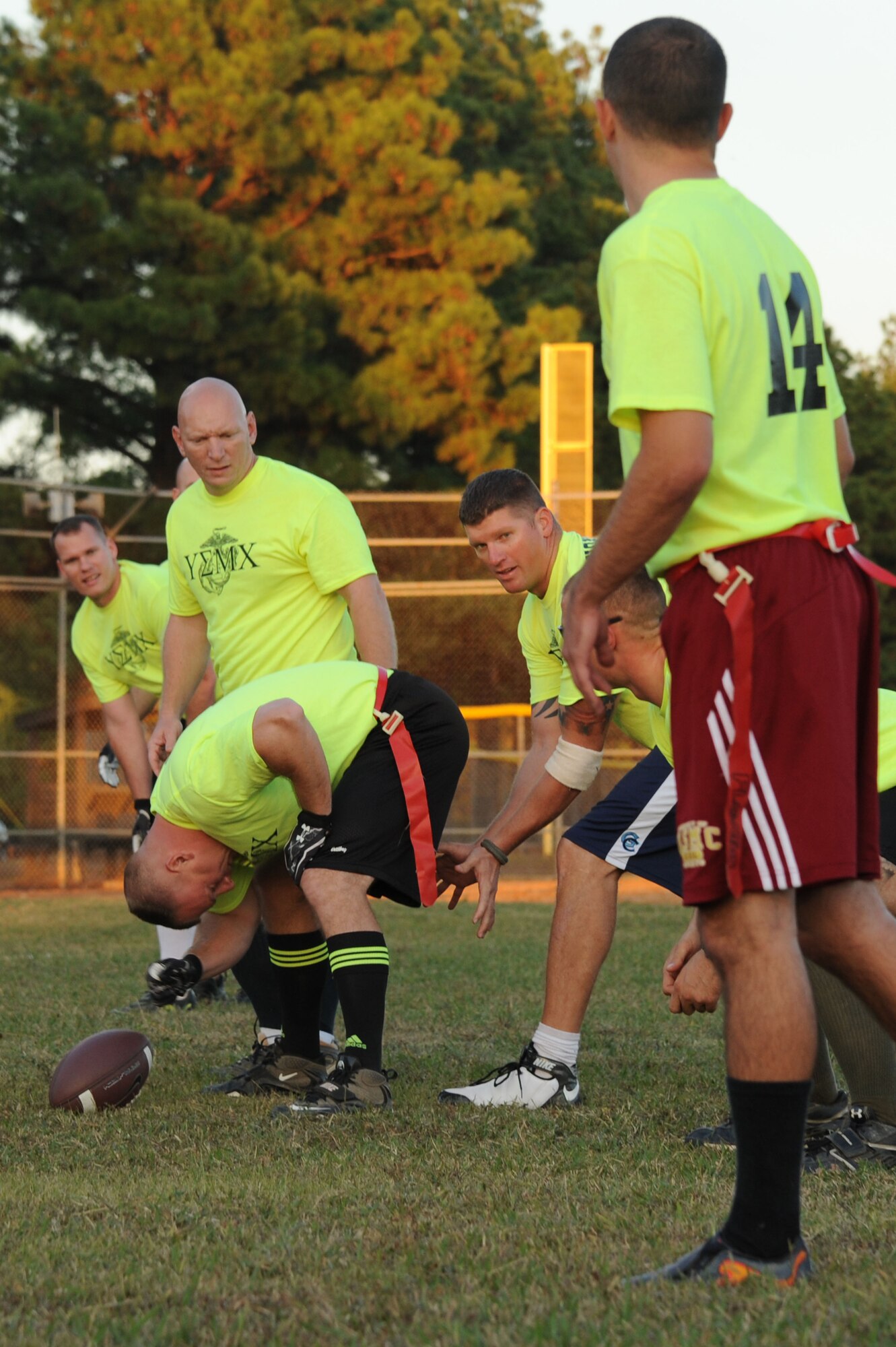 Ryan Postlewait,  Marines quarterback, prepares to snap the ball Tuesday during a flag football contest between the Marines and the 19th OG. The Marines scored 16 unanswered points in less than 10 minutes to claim the victory and preserve their undefeated season. (U.S. Air Force photo by Airman 1st Class Kaylee Clark)