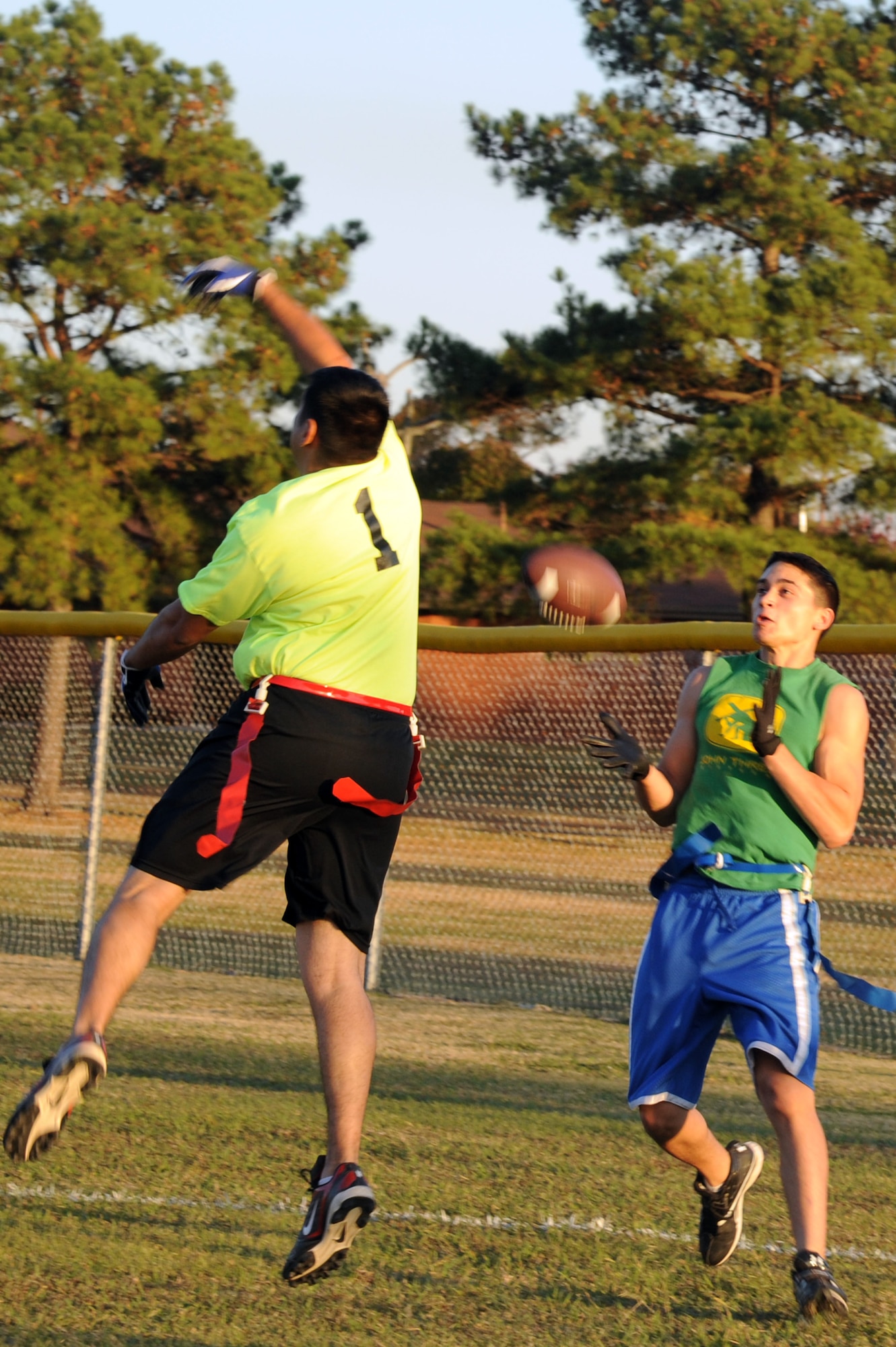 Dylan Gonzalez, 19th Operations Group wide receiver, catches a pass Tuesday to score the first touchdown of the game during a flag football contest between the Marines and the 19th OG . Gonzalez, the primary playmaker for the 19th OG, was targeted numerous times and had several big catches, but the 19th OG still fell short to the Marines 16-14.. (U.S. Air Force photo by Airman 1st Class Kaylee Clark)