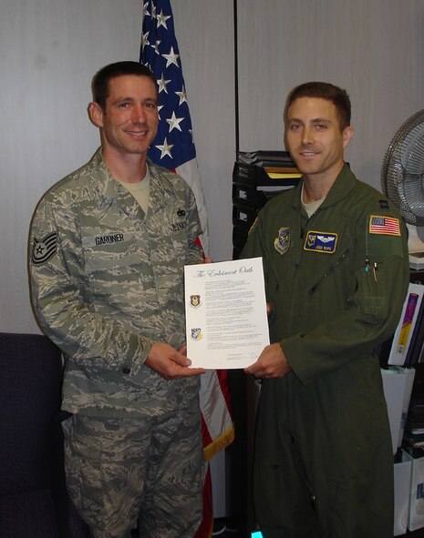 Recently, Tech. Sgt. Ian Gardner (left), re-enlists in the Air Force Reserve. Capt. Joshua Rope performed the re-enlistment ceremony. While not new to the 916th, Gardner is a member of the Aircrew Flight Equipment office. (USAF photo courtesy of 016AFE)