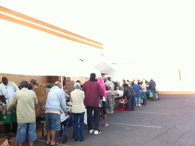 Nellis Air Force Base personnel volunteer at a food bank held at Living Faith Assembly to distributes food to community members Oct. 26, 2011. (Courtesy photo)
