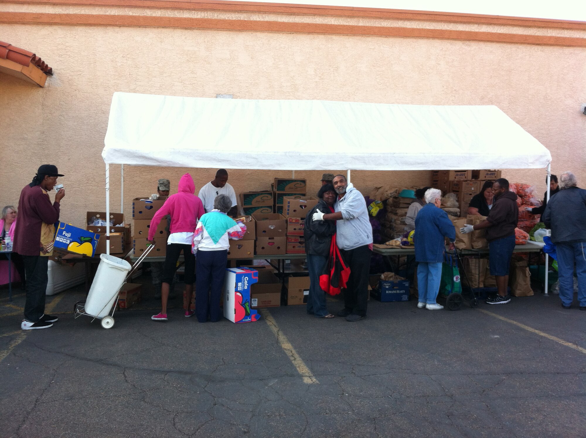 Nellis Air Force Base personnel volunteer at a food bank held at Living Faith Assembly to distributes food to community members Oct. 26, 2011. (Courtesy photo)