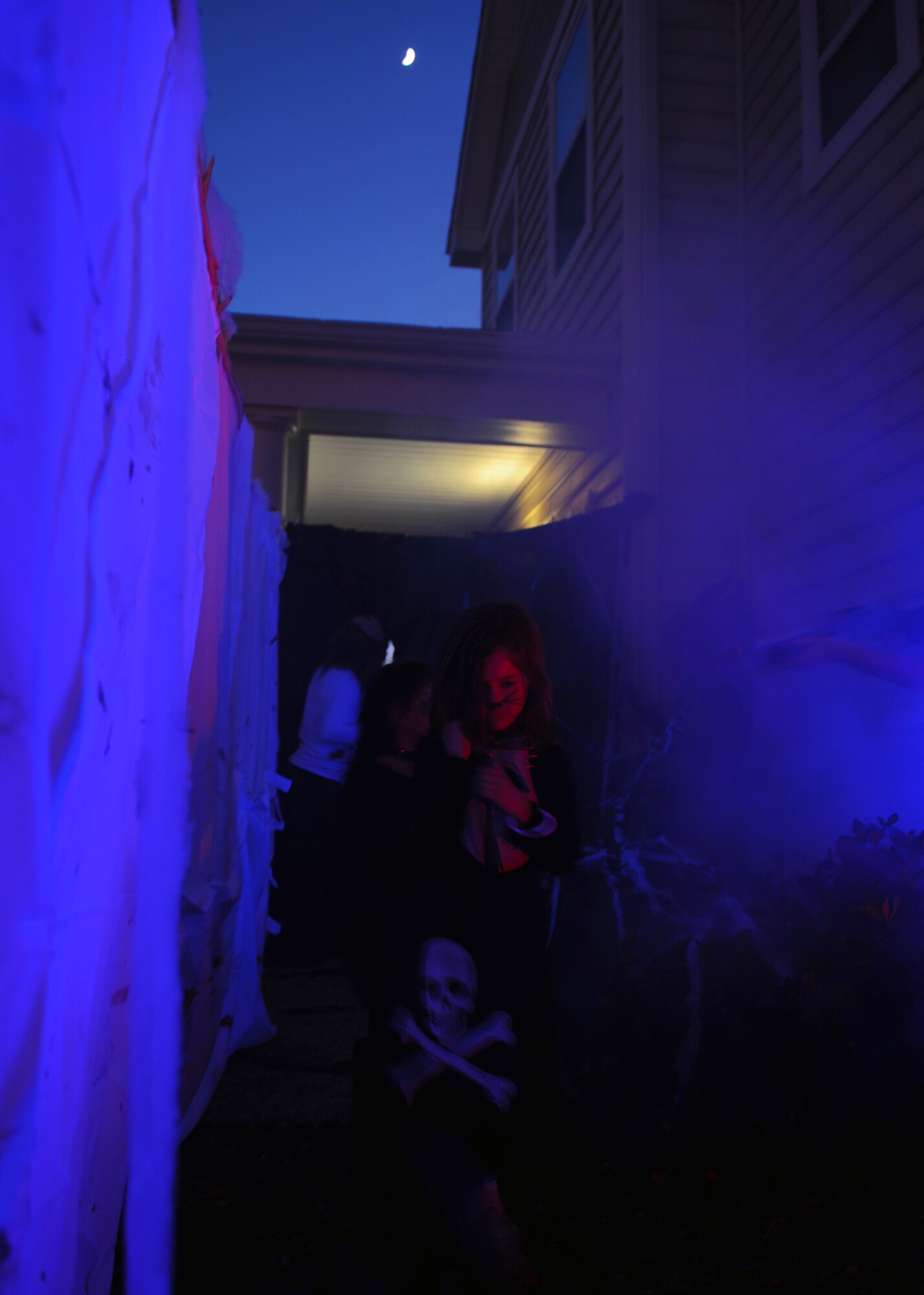 A child goes through the ‘field of screams’ to get candy during Halloween Oct. 31, 2011, at Dyess Air Force Base, Texas. Base housing was open to trick-or-treating from 6-8 p.m. (U.S. Air Force photo by Airman 1st Class Jonathan Stefanko/ Released)