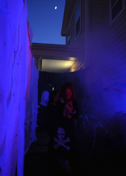 A child goes through the ‘field of screams’ to get candy during Halloween Oct. 31, 2011, at Dyess Air Force Base, Texas. Base housing was open to trick-or-treating from 6-8 p.m. (U.S. Air Force photo by Airman 1st Class Jonathan Stefanko/ Released)