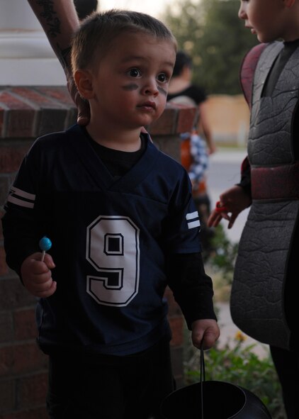 Donvan Sullins, 2, son of Staff Sgt. Clint Sullins, 7th Security Forces Squadron, waits to get candy during Halloween Oct. 31, 2011, at Dyess Air Force Base, Texas. Base housing was open to trick-or-treating from 6-8 p.m. (U.S. Air Force photo by Airman 1st Class Jonathan Stefanko/ Released)